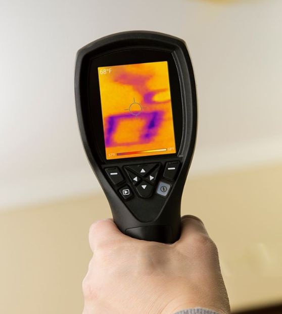 Thermal imaging camera used during a roof inspection to detect moisture and hidden leaks inside the home.